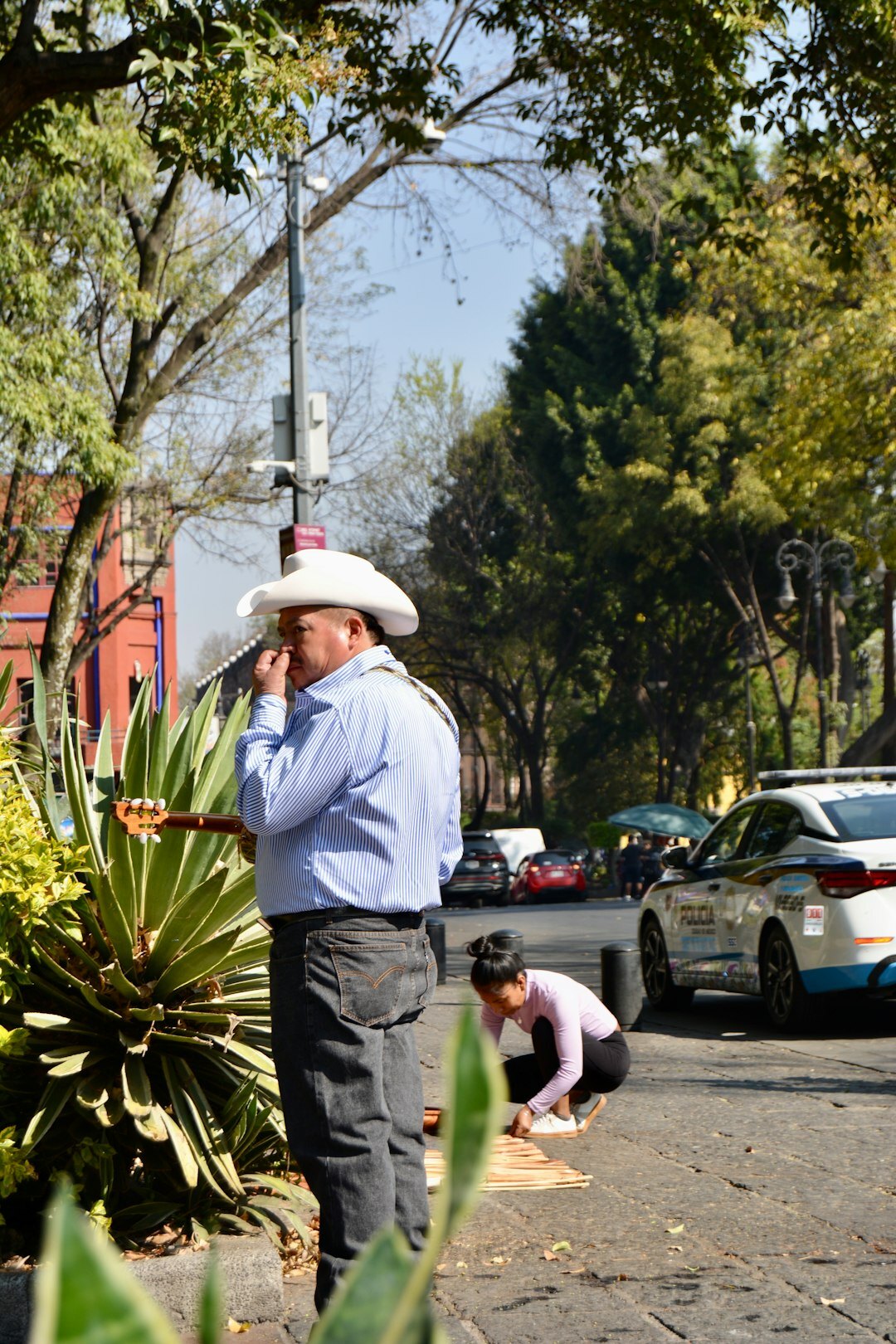 Mexican financial advisor writing notes during a client meeting