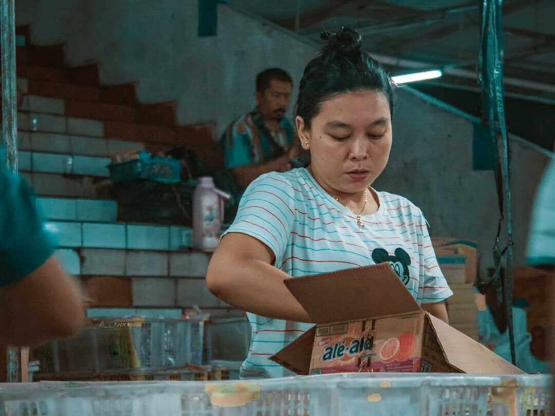 Mexican accountant reviewing documents with a calculator