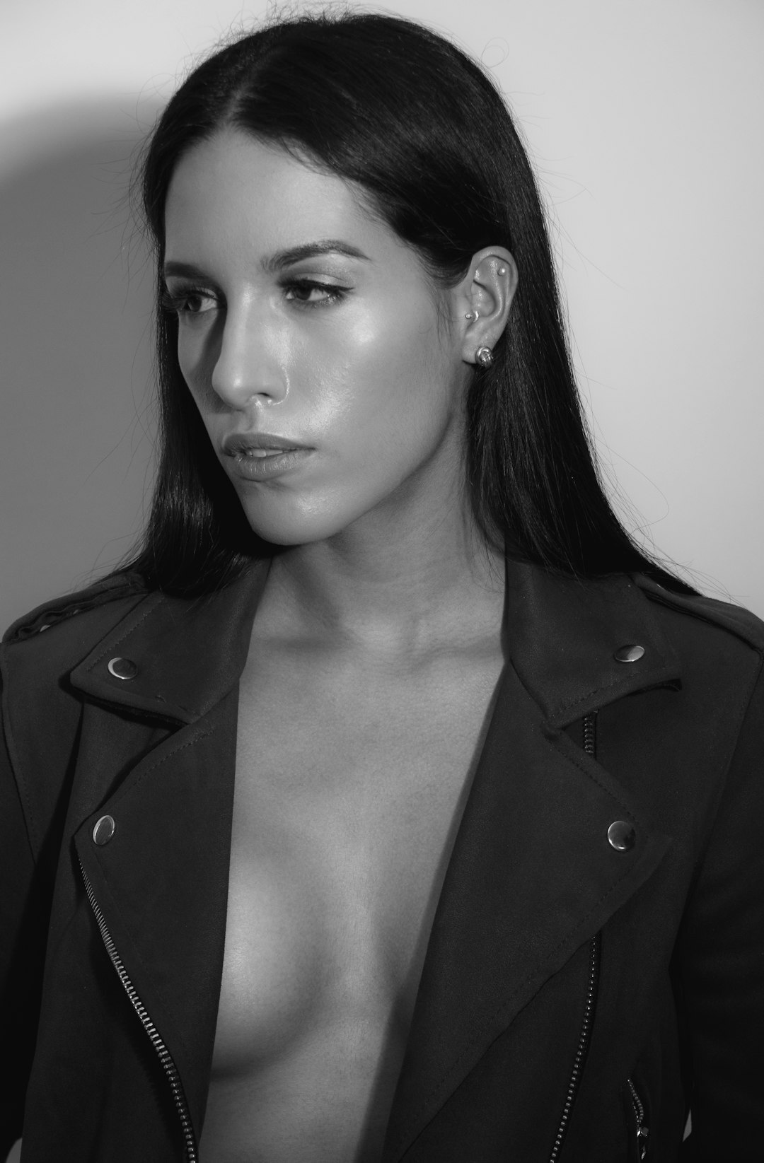 Studio portrait of a Mexican businesswoman in a tailored blazer