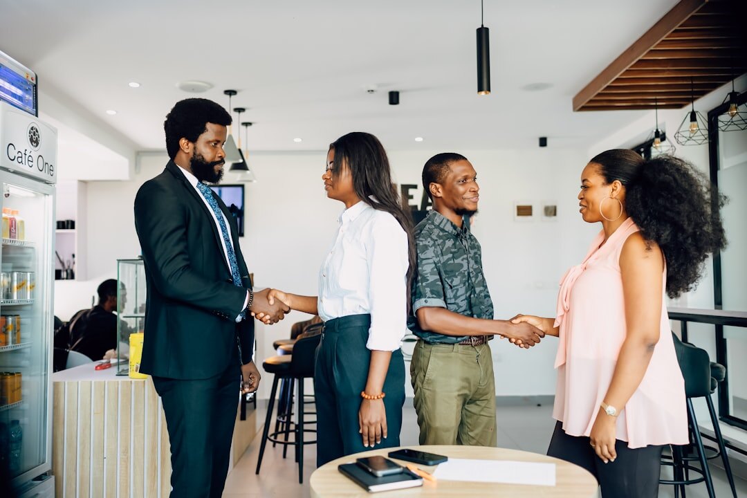 investors shaking hands in meeting
